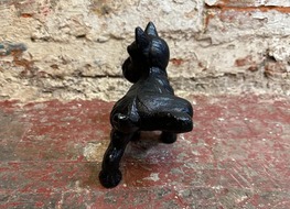 urinating dog doorstop